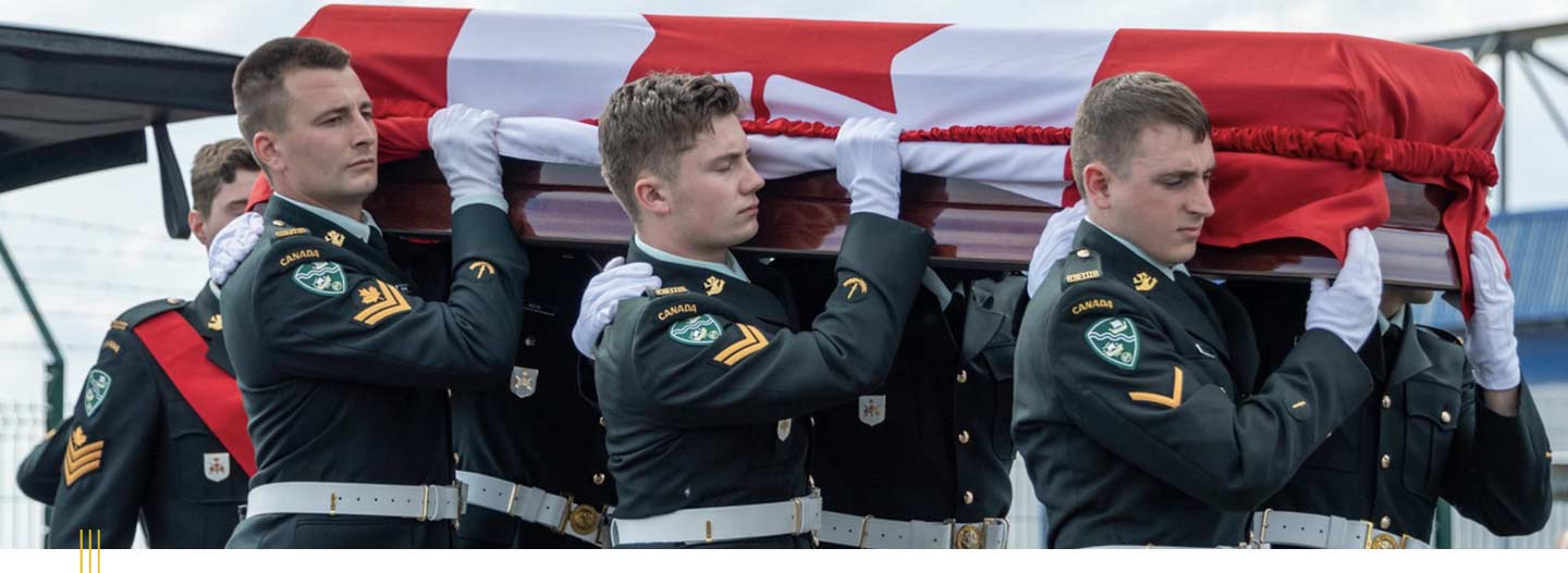 Young members of The Royal Newfoundland Regiment and Canadian Armed Forces acting as pallbearers, carrying the remains of the Unknown Newfoundland Soldier.